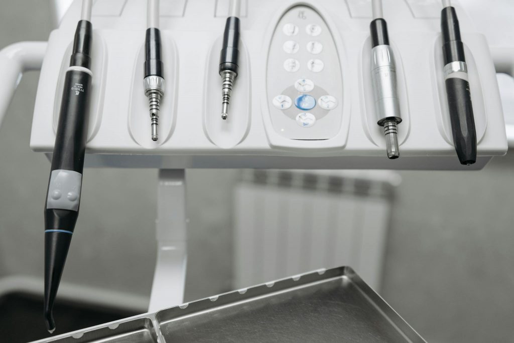 Detailed shot of modern dental tools in a dentist's office, emphasizing precision and hygiene.